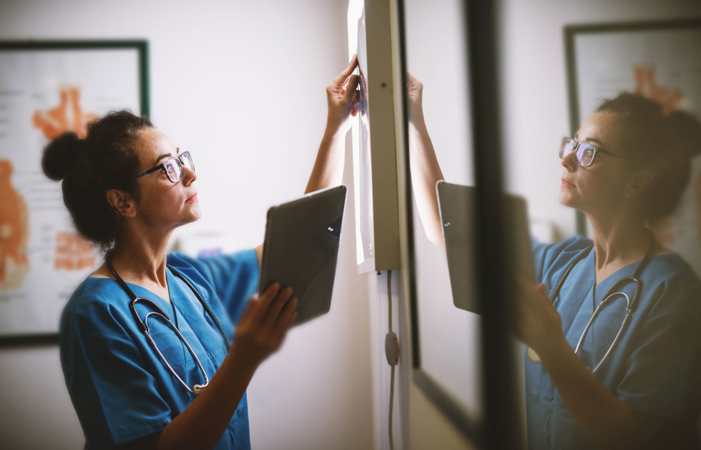 young female doctor examines xray