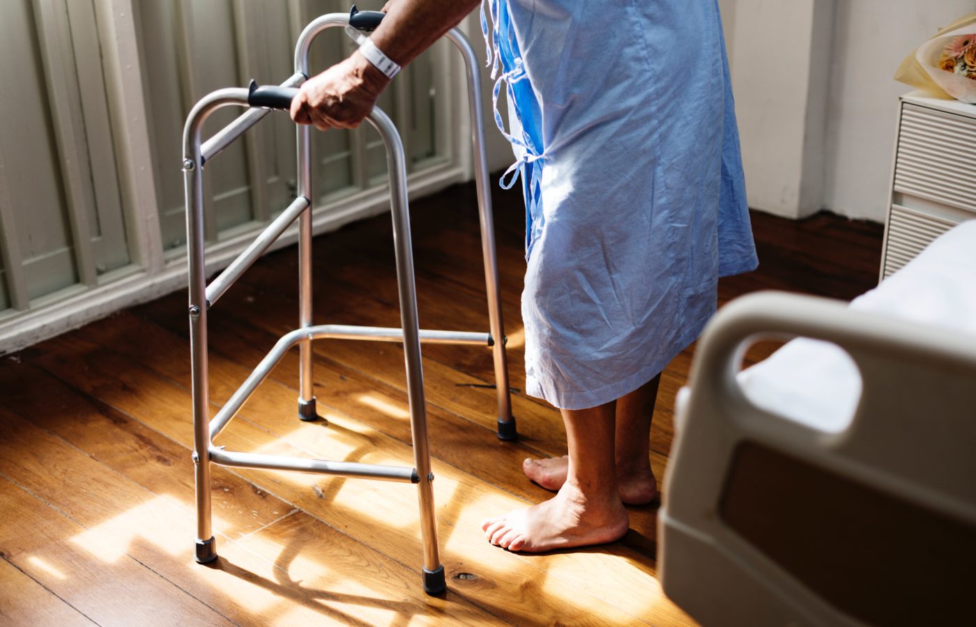 Elderly patient hospital bed and walker