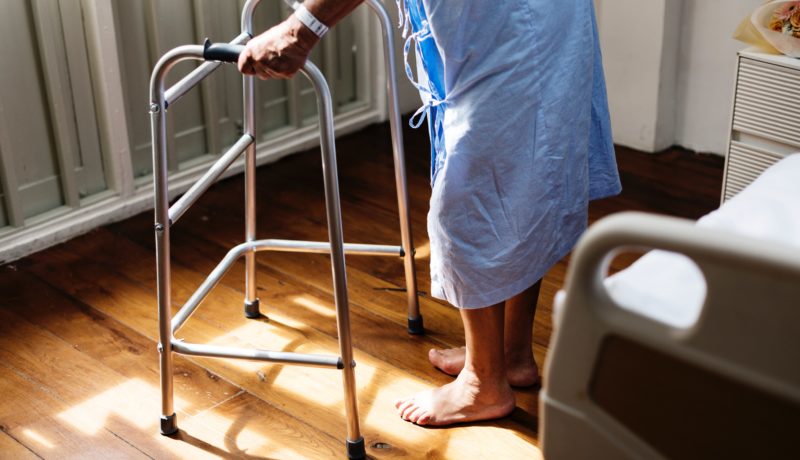 Elderly patient hospital bed and walker