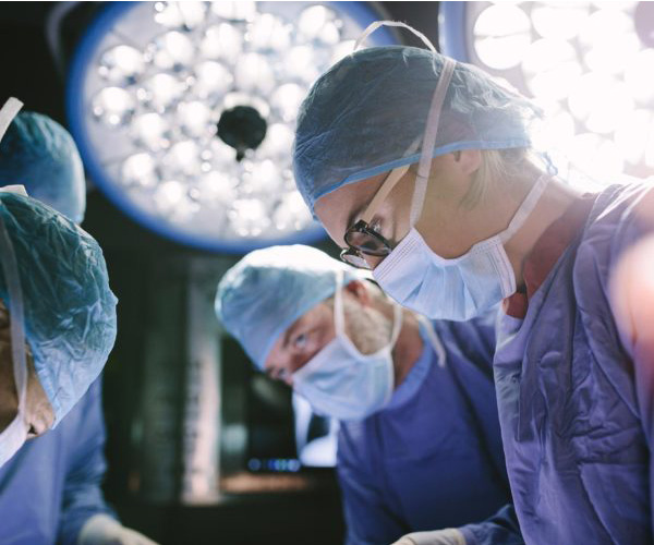 Physicians work in an operating room