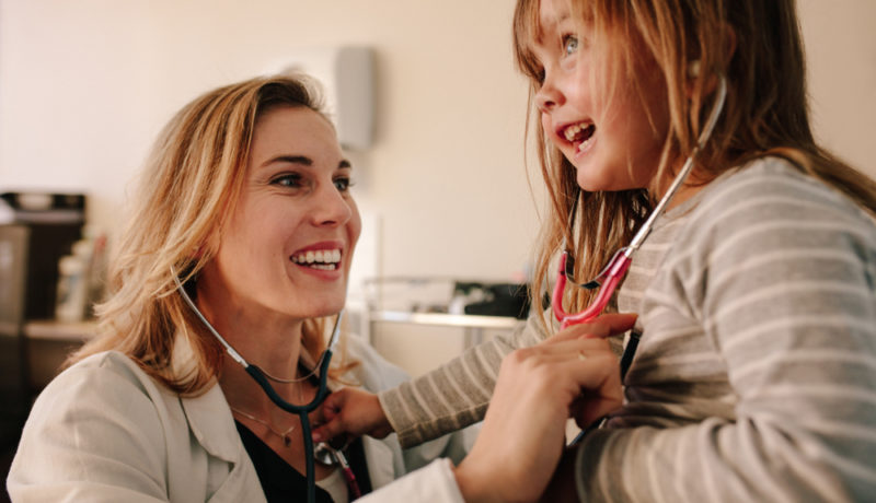 Female physician stethoscope child wellness